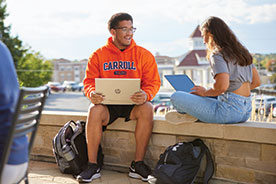 Students studying outside. Links to Donor-Advised Funds
